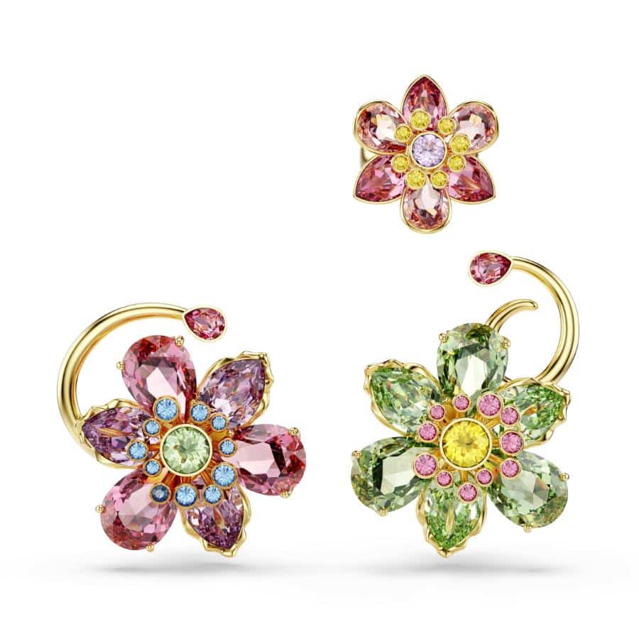 Swarovski Idyllia ear cuff set with three asymmetrical gold-tone flower designs featuring multicolored and mixed cuts.