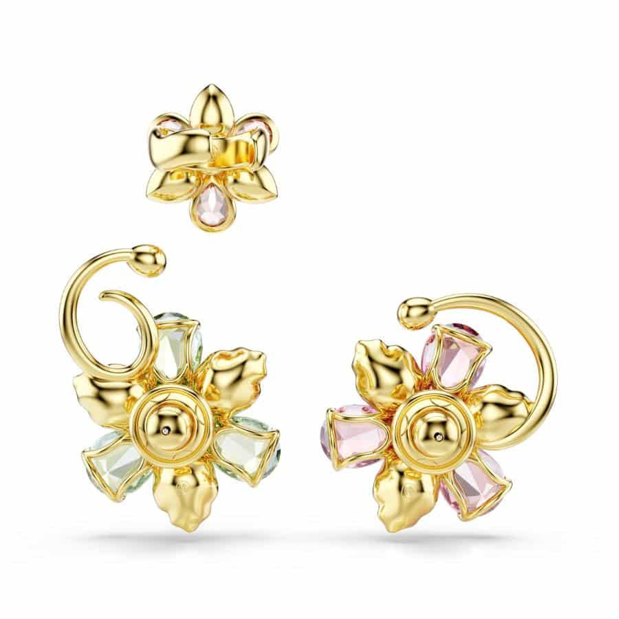 Swarovski Idyllia ear cuff set with three asymmetrical gold-tone plated cuffs featuring multicolored flower designs and mixed cuts.