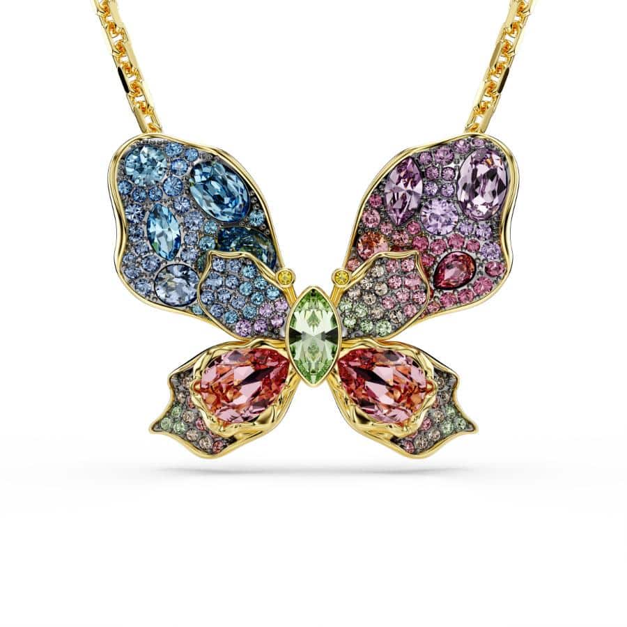 Swarovski Idyllia pendant and brooch with multicolored butterfly design, mixed cuts, pavé setting, and mixed metal finishes.