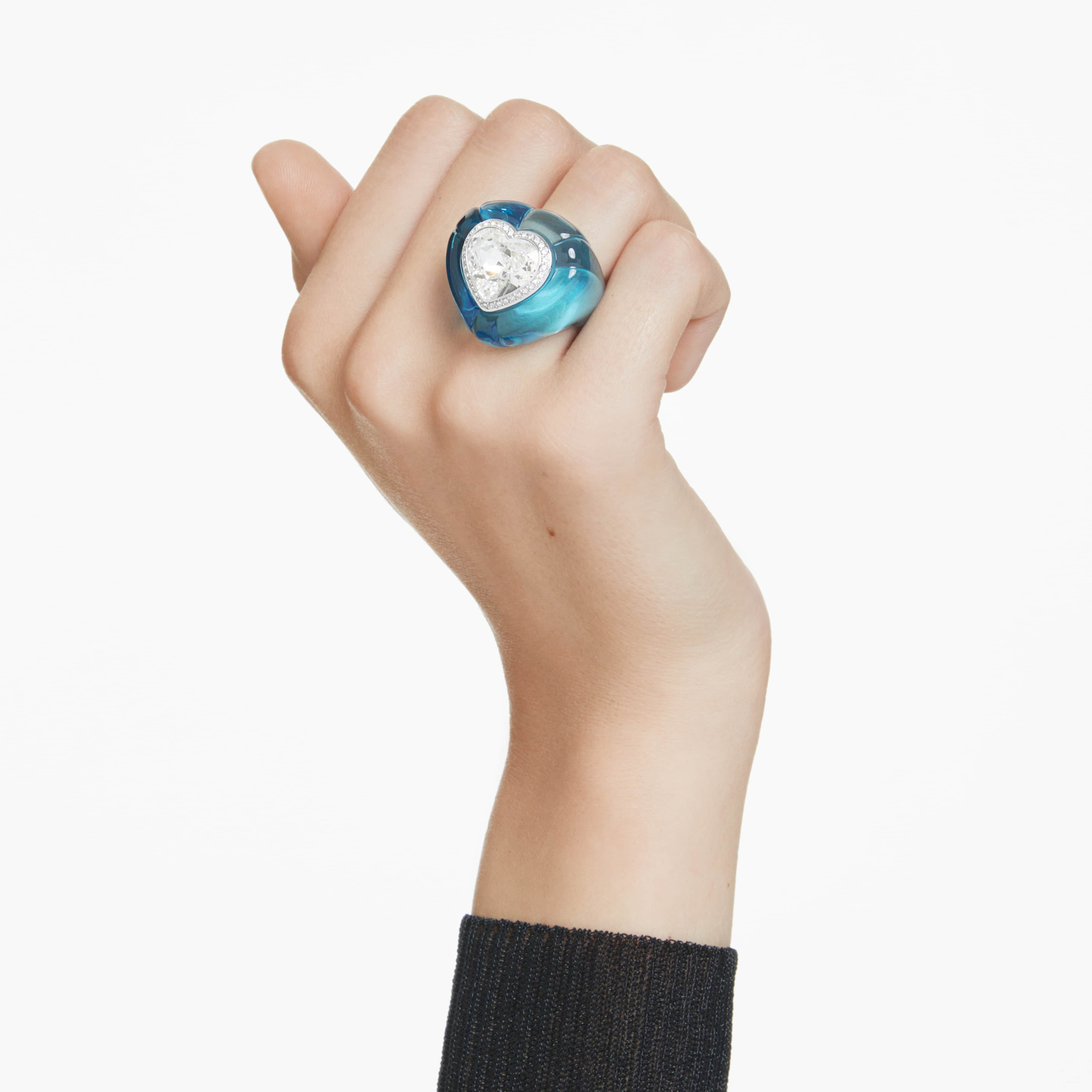 Swarovski Dulcis cocktail ring with heart-shaped blue crystal, pavé setting, and elegant heart design.