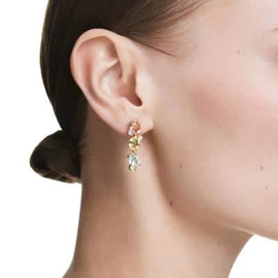 Swarovski Gema Drop Earrings with asymmetrical mixed-cut multicolored crystals and gold-tone plating.