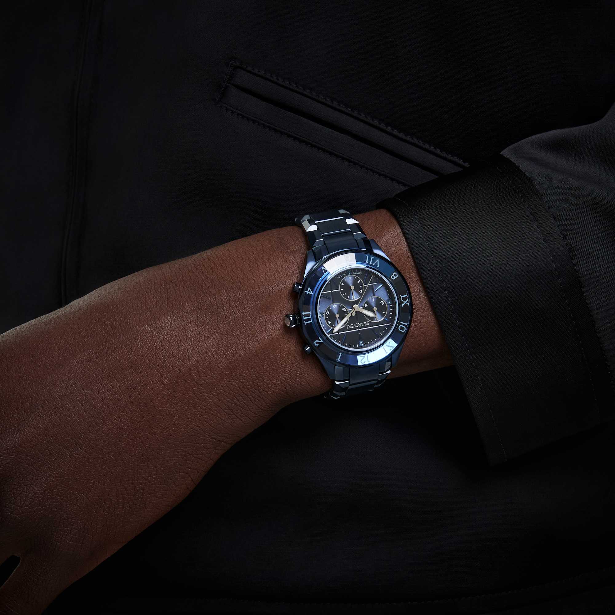 Swarovski Dextera Chrono watch with 39mm blue dial, Swiss Made, metal bracelet, and blue finish on a sleek wrist.