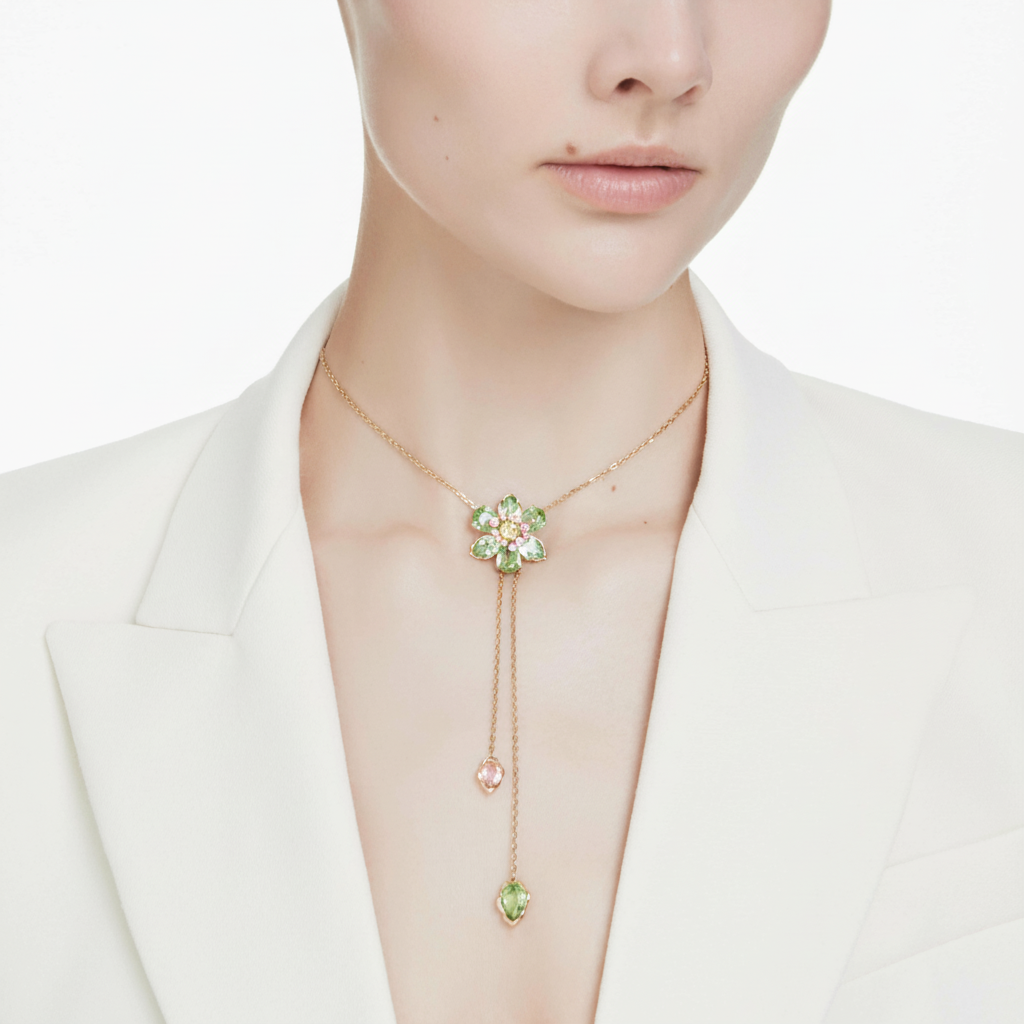 Swarovski Idyllia Y pendant with multicolored mixed cuts flower design in gold-tone plating, showcasing intricate gemstone details.