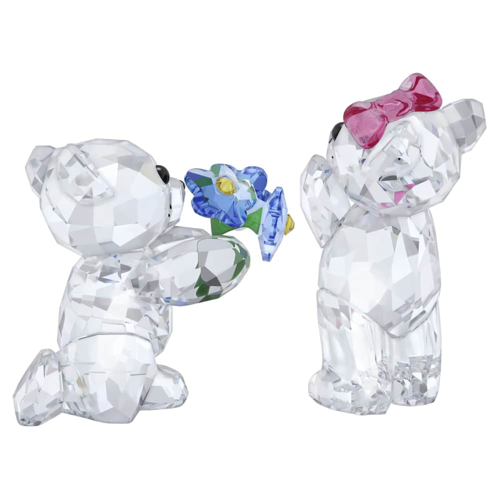 Swarovski Kris Bear figurine with "I adore you" inscription, crafted with clear crystal and detailed features.