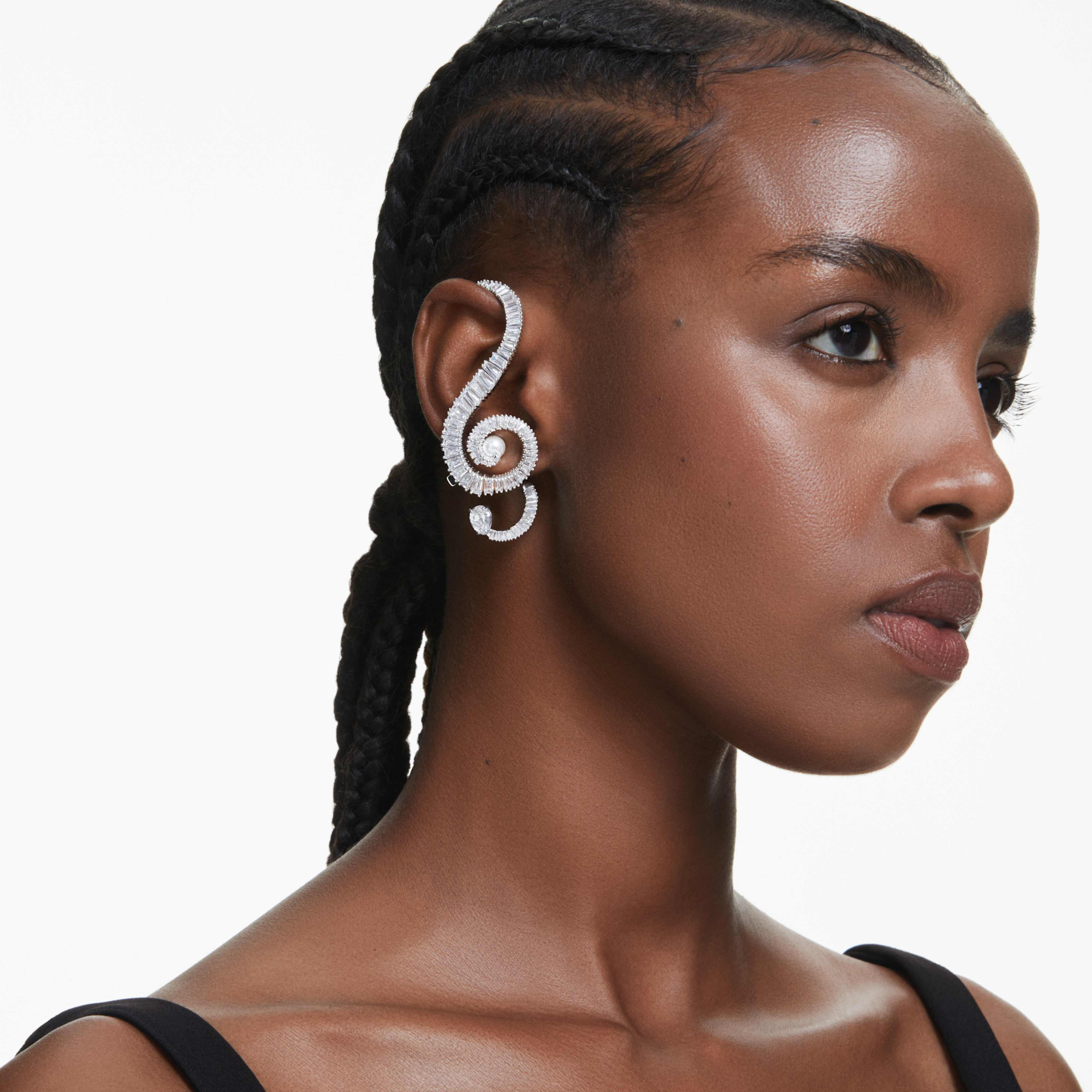 Swarovski Ariana Grande clip earrings with asymmetrical design, white crystal pearls, baguette cut crystals, rhodium plated.