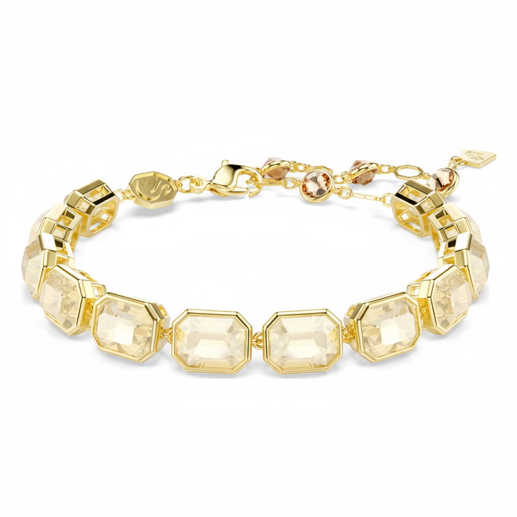 Swarovski Millenia tennis bracelet with octagon cut caramel crystals in gold-tone plated setting, elegant jewelry accessory.