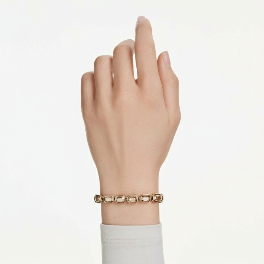Swarovski Millenia tennis bracelet with octagon-cut caramel crystals on gold-tone plated band, elegant jewelry accessory