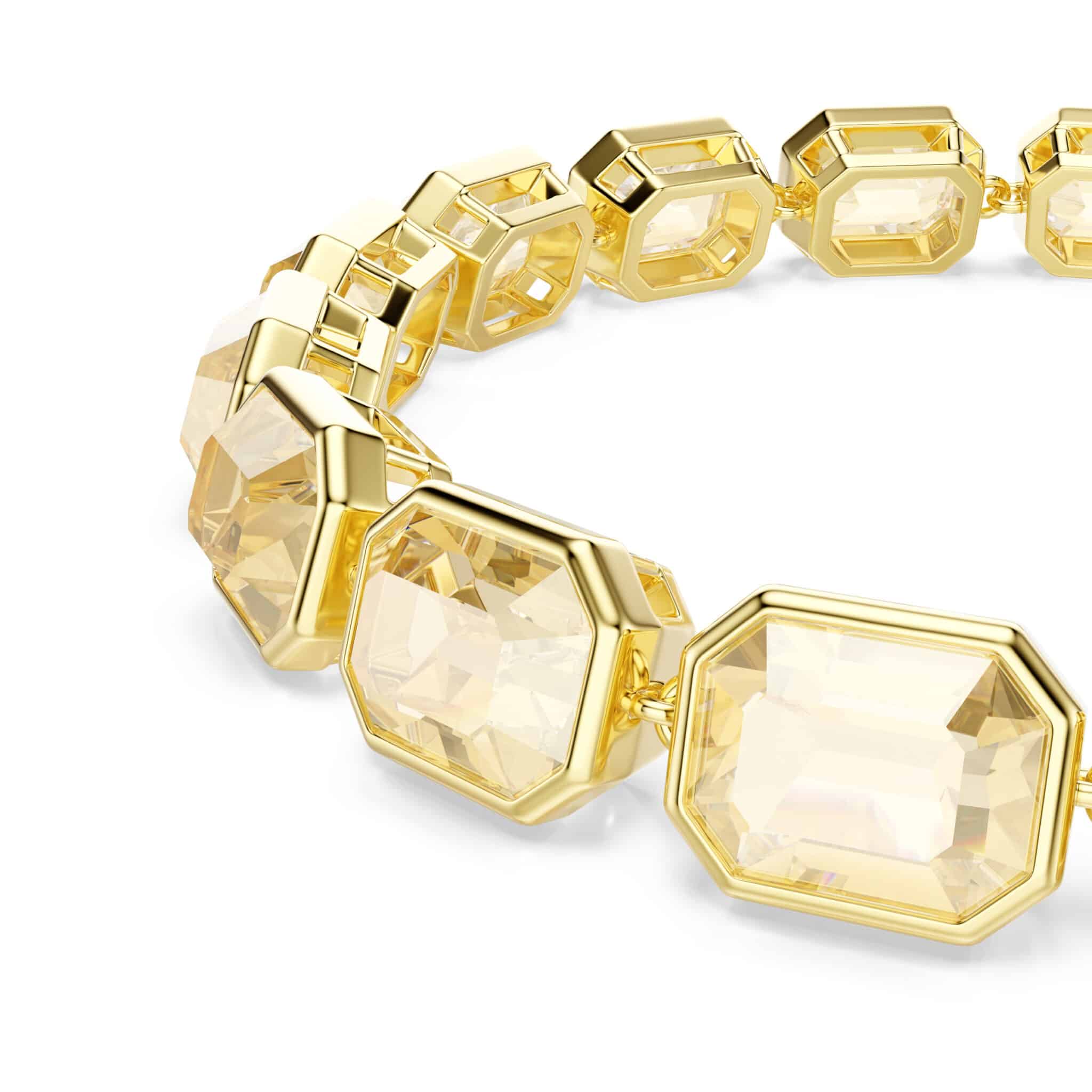 Swarovski Millenia tennis bracelet with octagon-cut caramel crystals in gold-tone plating, elegant jewelry accessory.