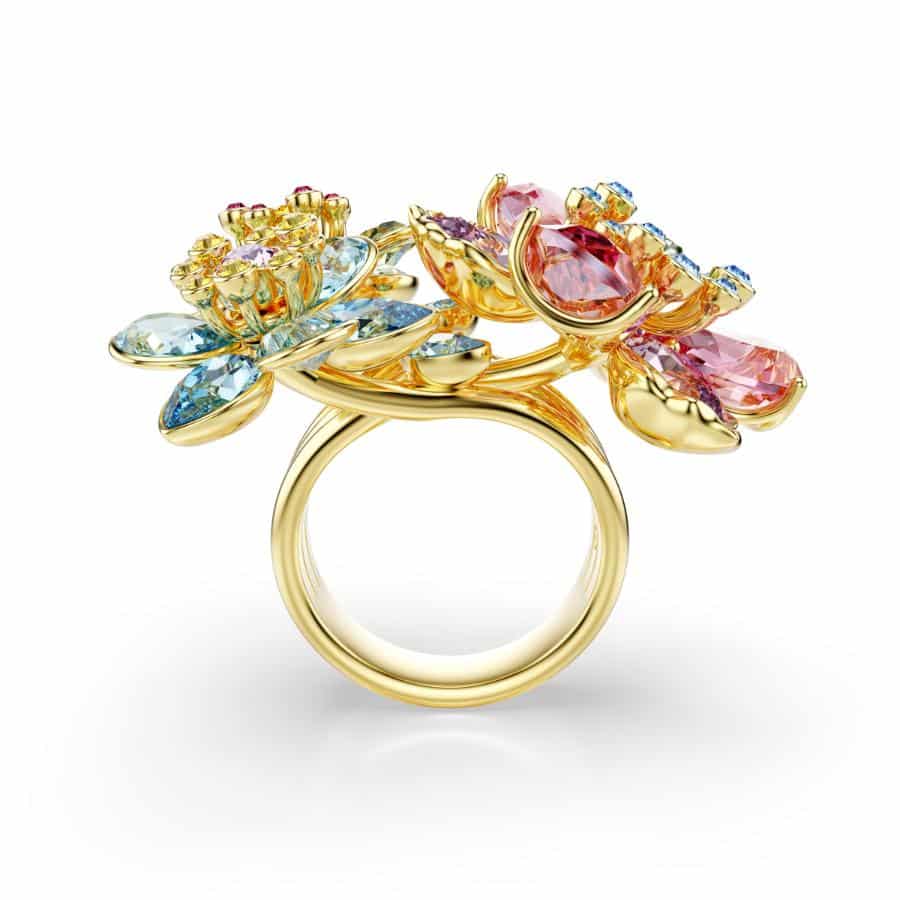 Swarovski Idyllia flower ring with mixed multicolored crystals and gold-tone plating, featuring a delicate floral design.