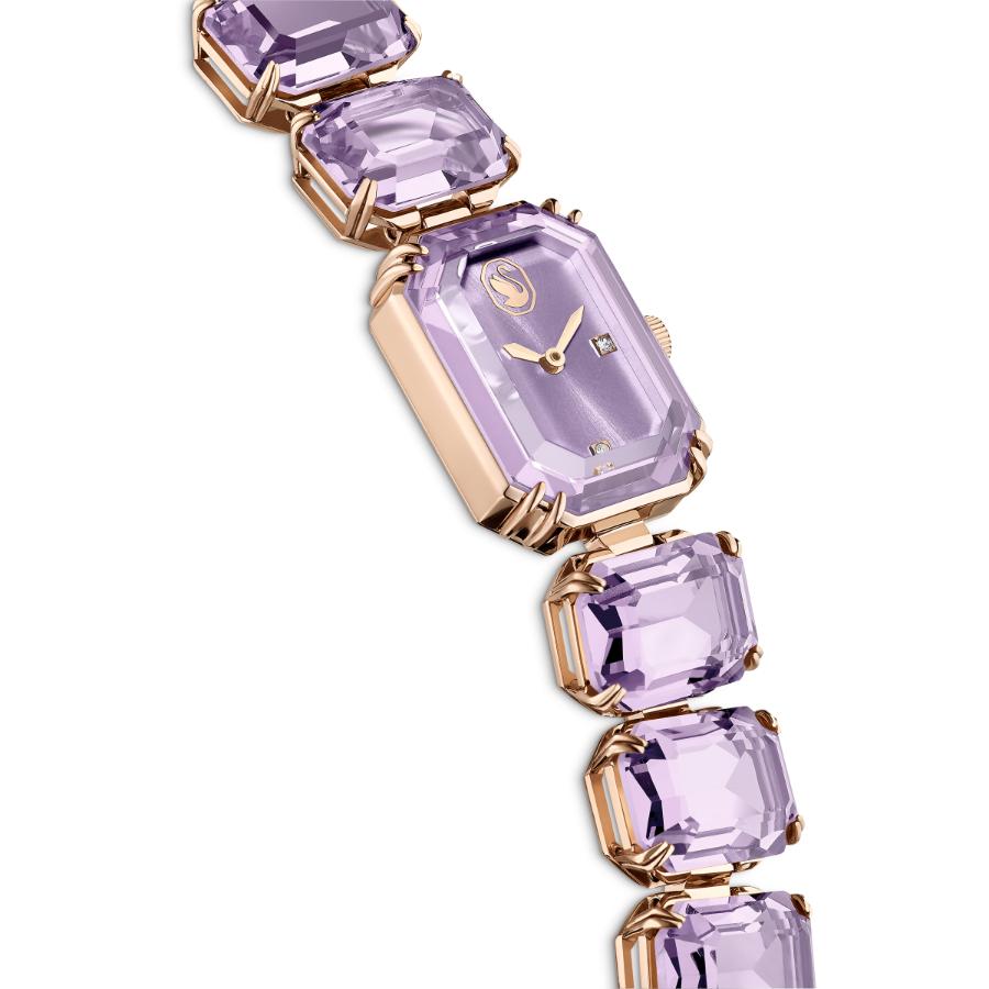 Swarovski watch with an octagon cut purple bracelet and champagne gold-tone finish, showcasing elegant jewelry design.