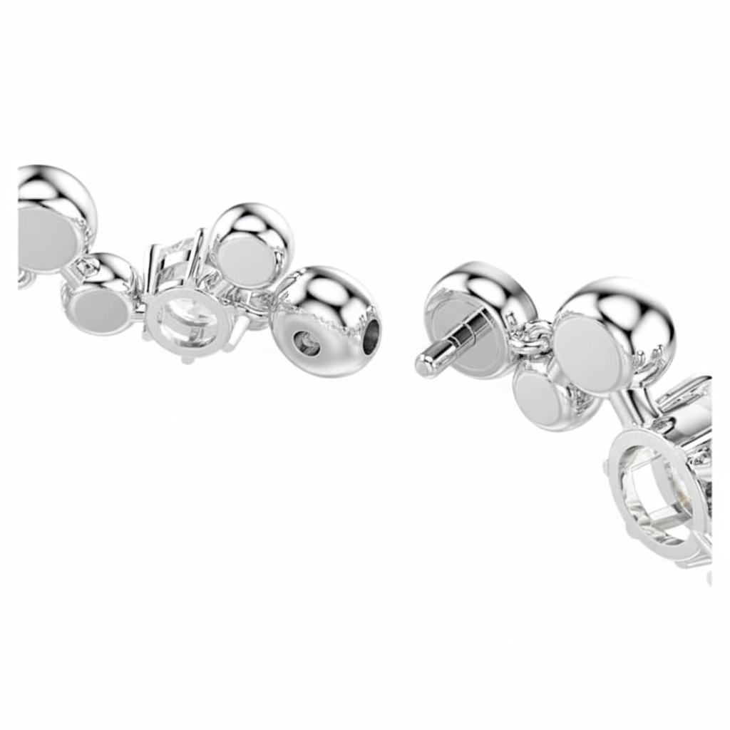 Swarovski Constella bracelet with mixed-cut white crystals and rhodium plating, showcasing elegant jewelry design.