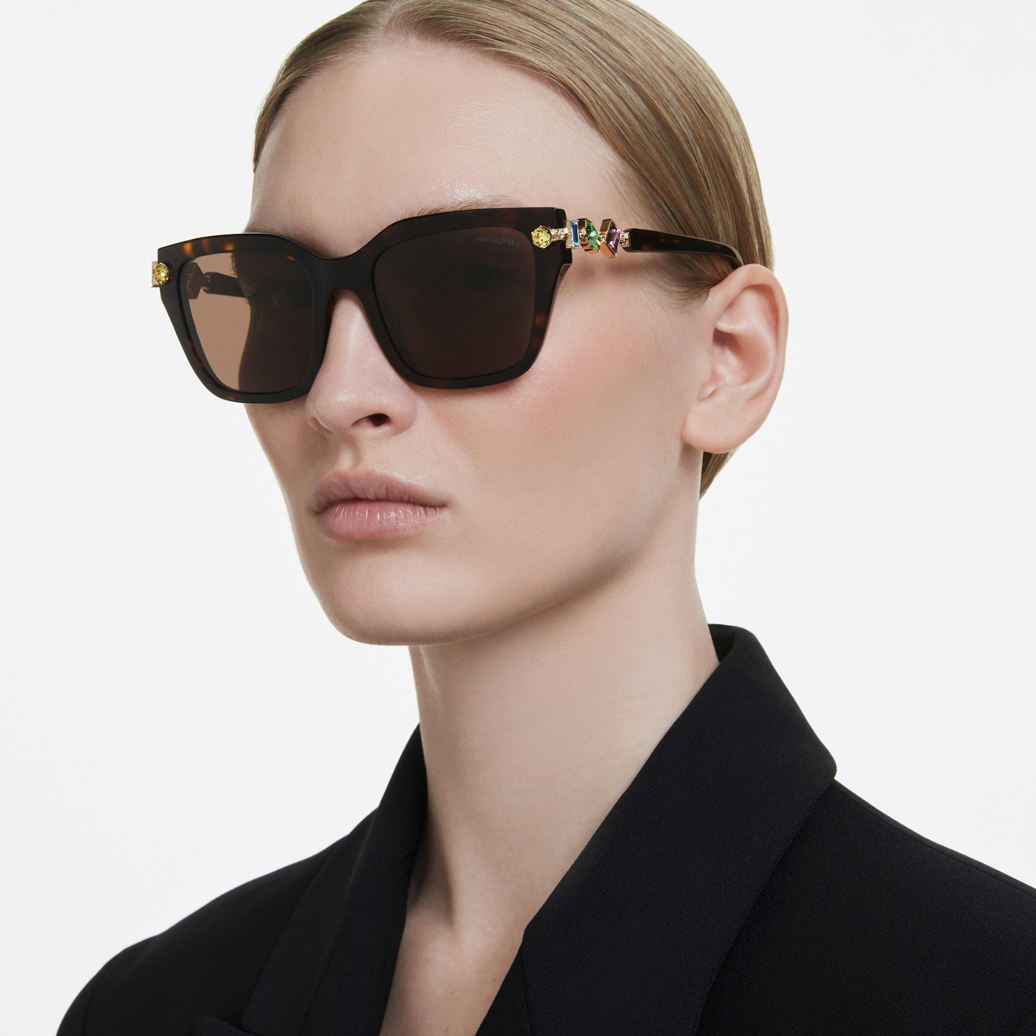 Swarovski square-shaped brown sunglasses with sleek frames and tinted lenses for a stylish, sophisticated look.