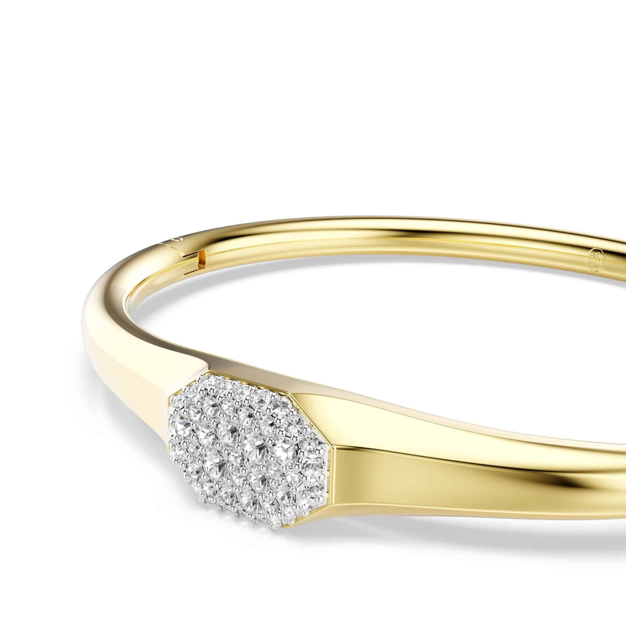 Swarovski Dextera gold-tone plated bangle with round cut white crystals, elegant jewelry accessory.