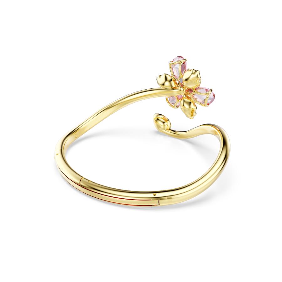 Swarovski Idyllia bangle with shimmering crystal accents and elegant silver-tone design, showcasing intricate craftsmanship.