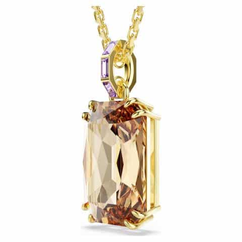 Swarovski Millenia pendant with octagon cut caramel crystal, gold-tone plated jewelry piece, showcasing elegant design and sparkling facets.