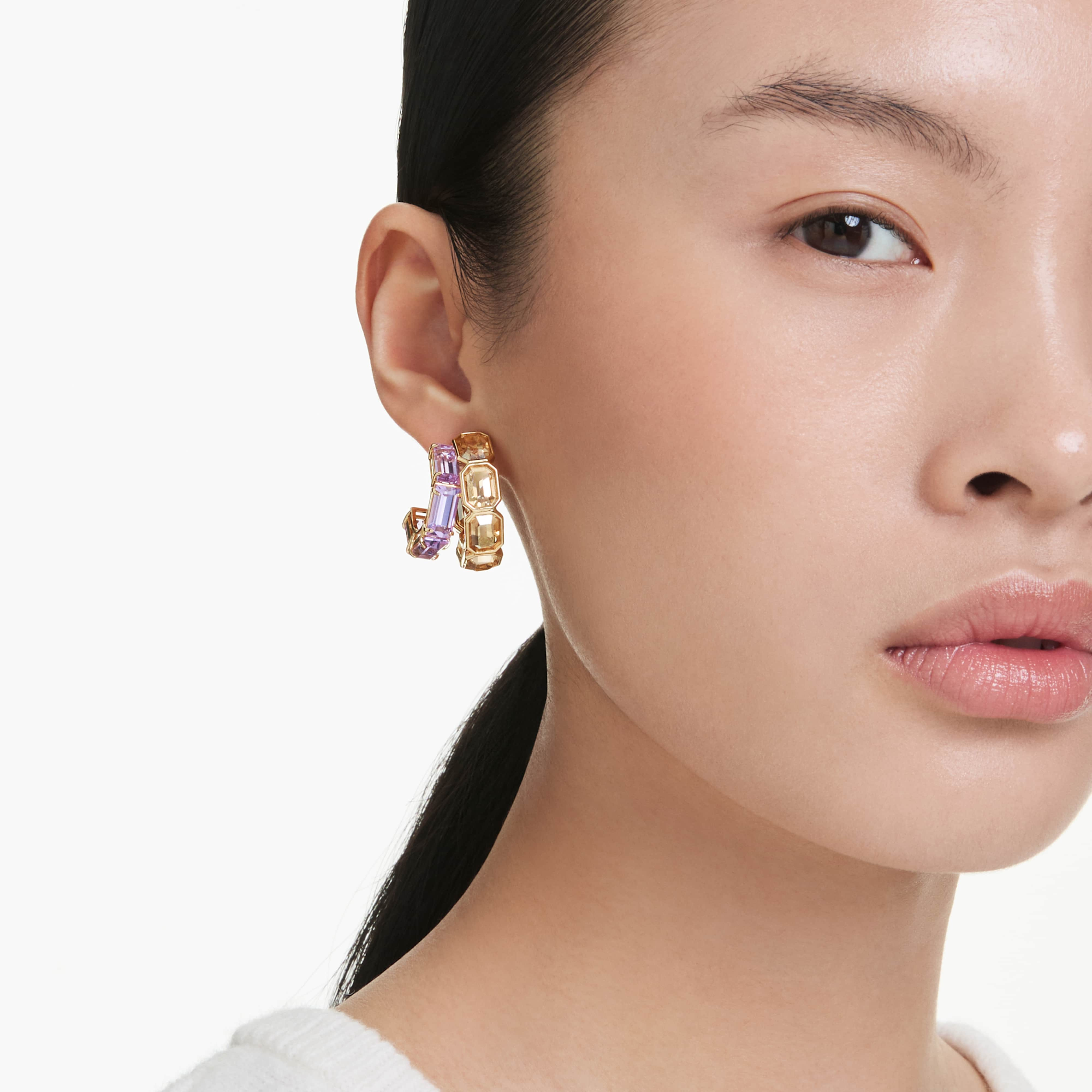 Swarovski Millenia hoop earrings with mixed cuts, multicolored crystals, gold-tone plated, showcasing elegant jewelry design.