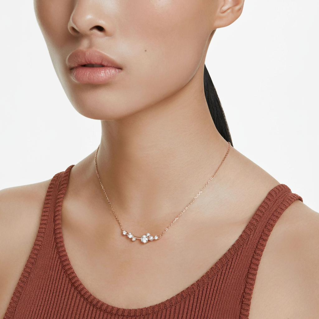 Swarovski Constella necklace with crystal pearl and round cuts in rose gold plating, elegant jewelry accessory.