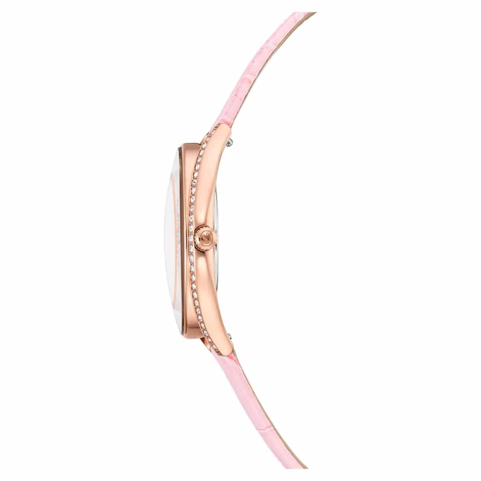 Swarovski Crystalline Aura Swiss-made watch with pink leather strap and rose gold-tone finish, showcasing elegant design details.