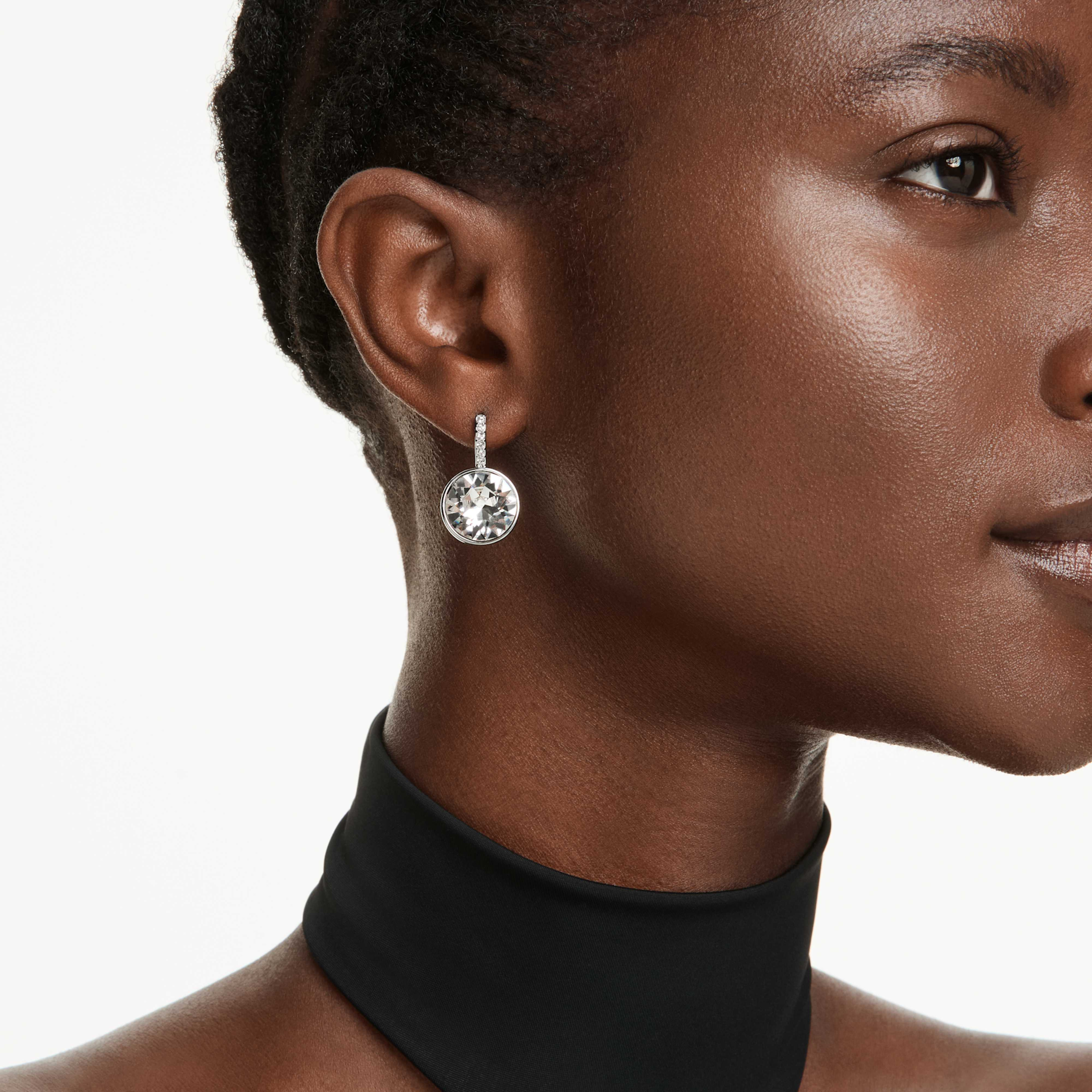 Swarovski Millenia drop earrings with round white crystal stones and rhodium-plated setting, elegant jewelry for special occasions.