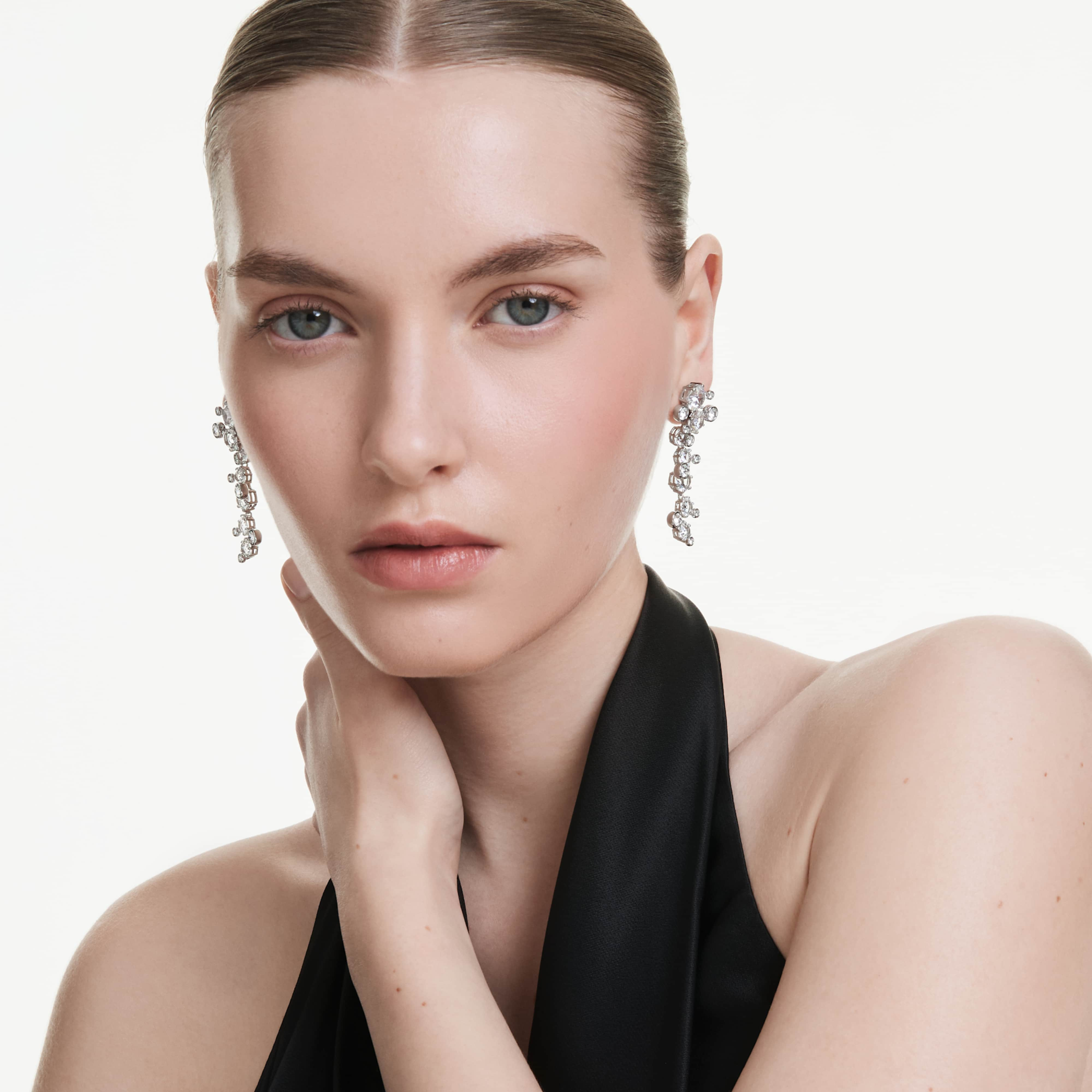 Swarovski Constella drop earrings with mixed cuts, white crystals, rhodium plating, featuring elegant dangling design.