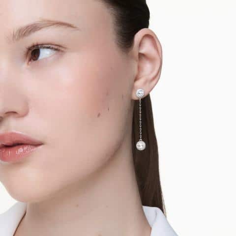 Swarovski Una Angelic Drop Earrings with round cut white crystals and rhodium plating, showcasing elegant jewelry design.