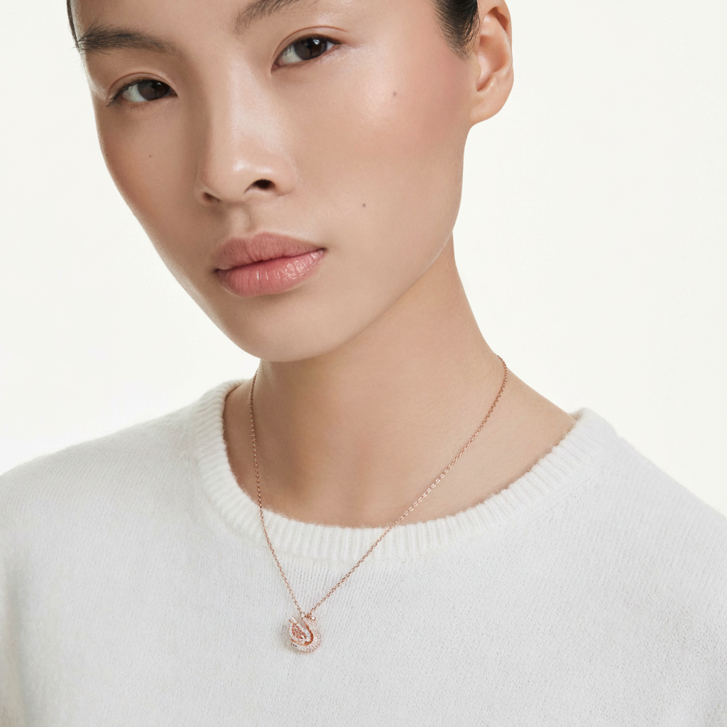 Swarovski Swan Pendant with pink crystals and mixed-cut stones, elegant jewelry piece featuring a graceful swan design.