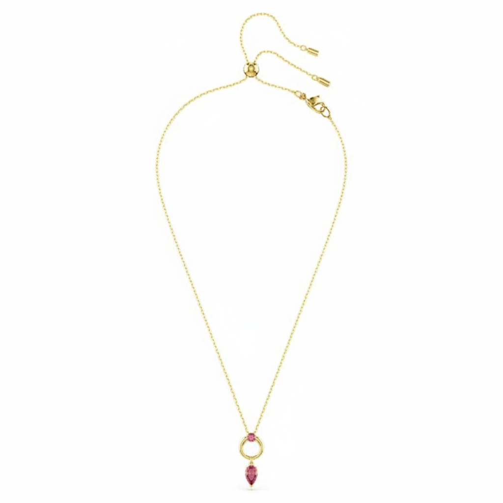 Swarovski Mesmera pendant with mixed red crystal cuts and gold-tone plating, elegant jewelry piece with intricate design.