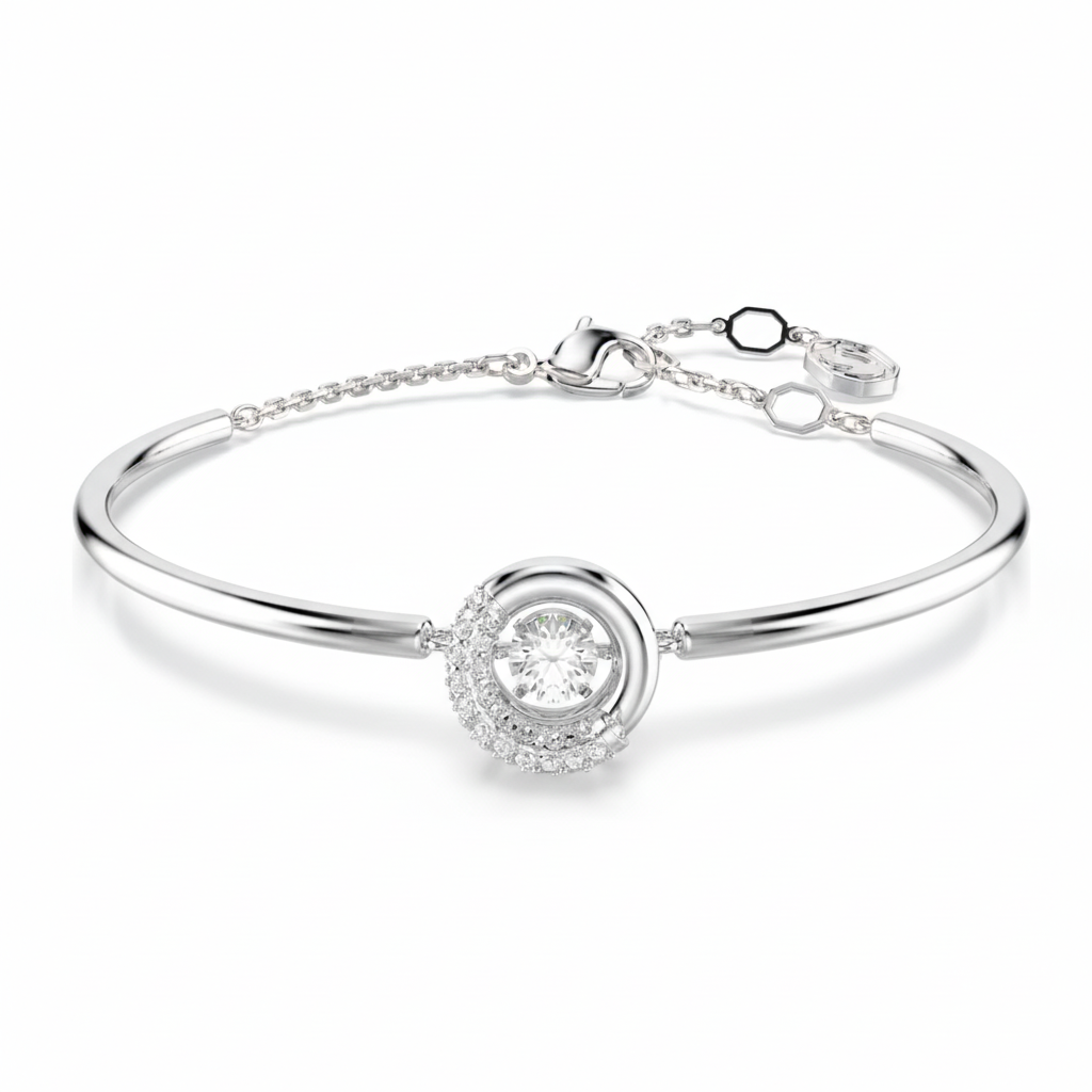Swarovski Dextera bangle featuring sparkling clear crystals and a sleek silver-tone metal design.