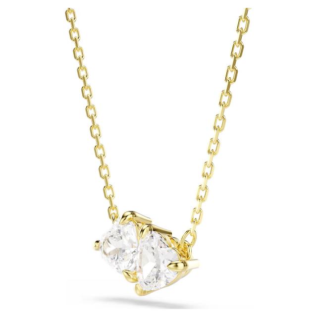 Swarovski Mesmera necklace with heart pendant in white and gold-tone plating, elegant jewelry piece on a display.