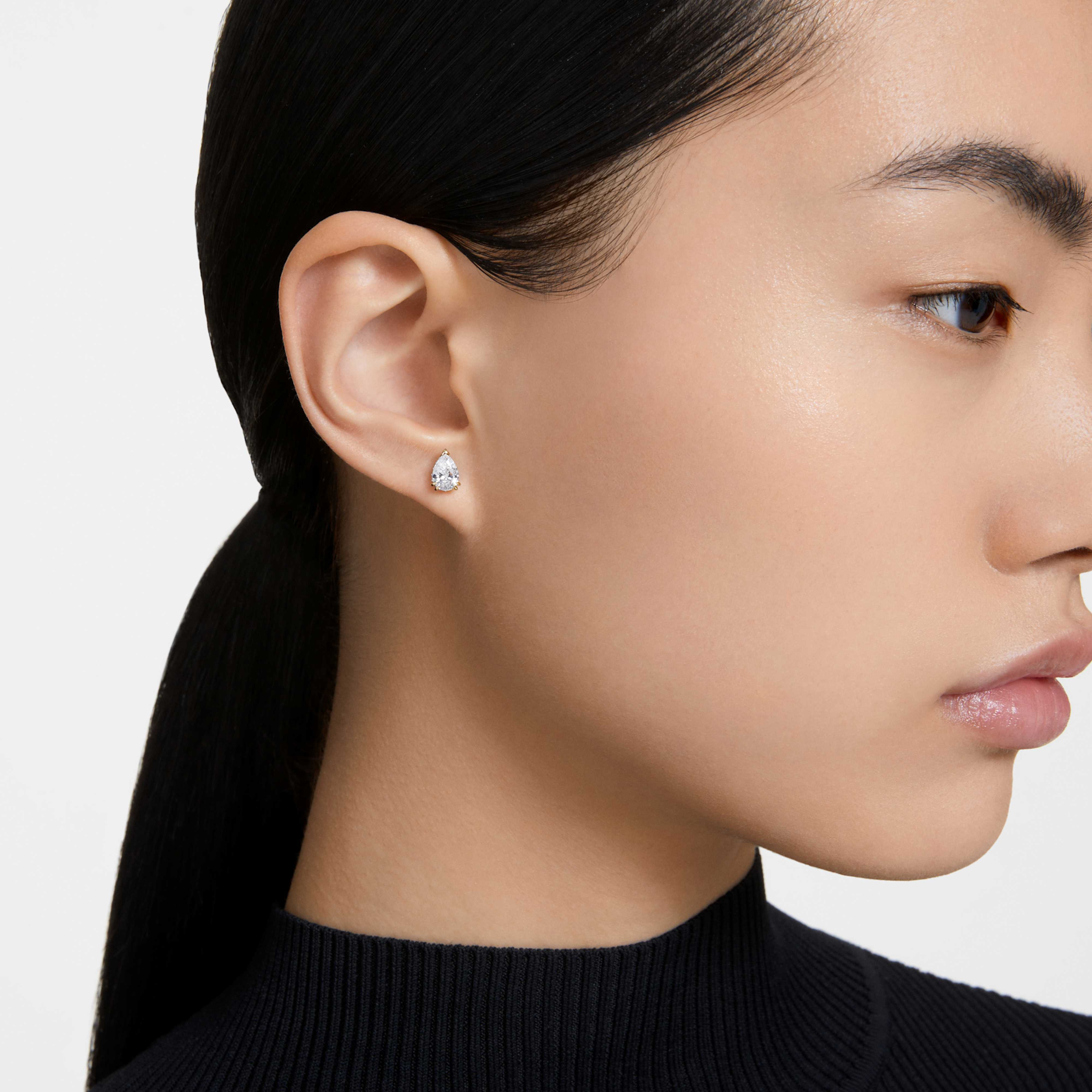 Swarovski Stilla earrings in rose gold tone plating with white crystal accents, elegant jewelry for special occasions.