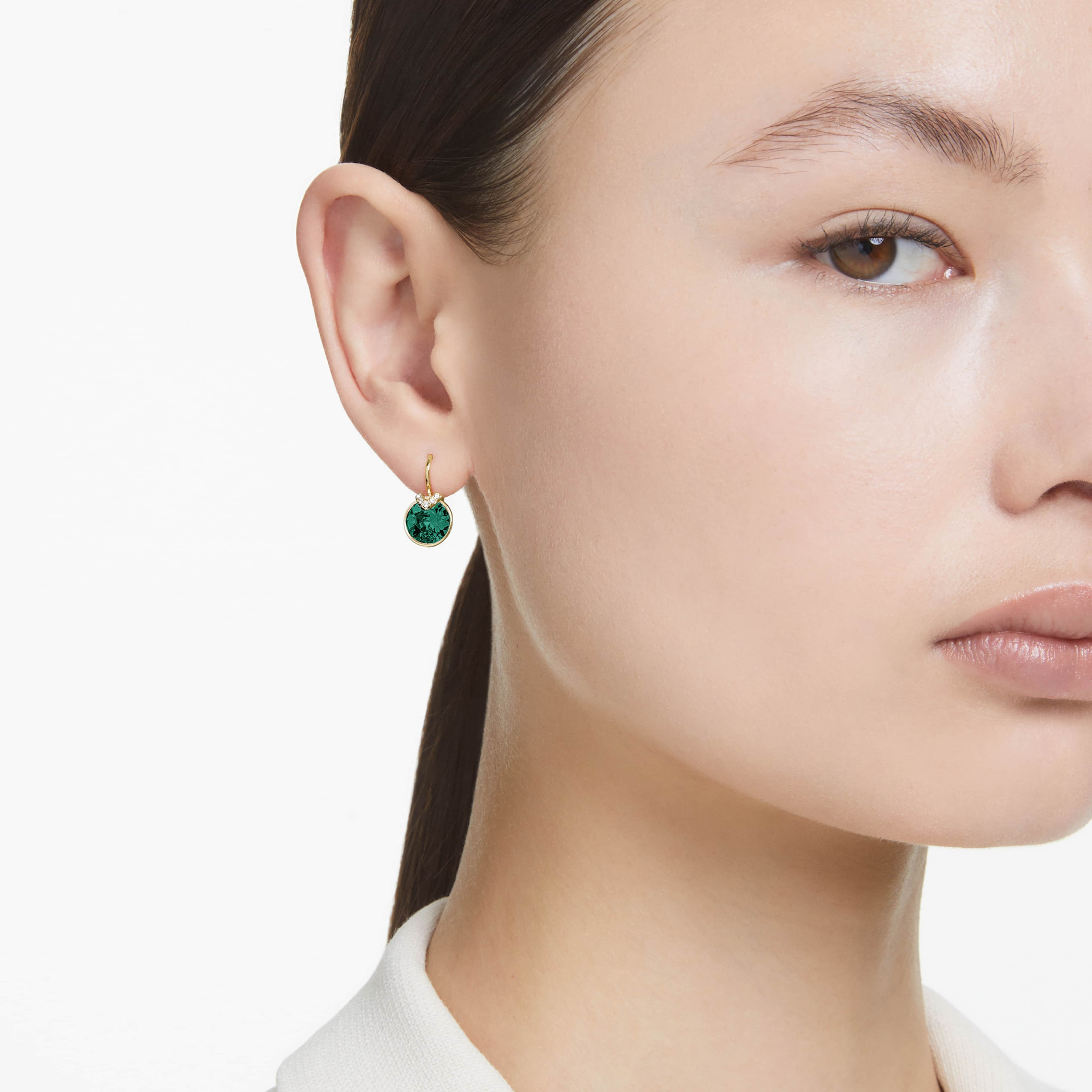 Swarovski Bella V Drop Earrings with round green crystals and gold-tone plated setting, elegant jewelry accessory