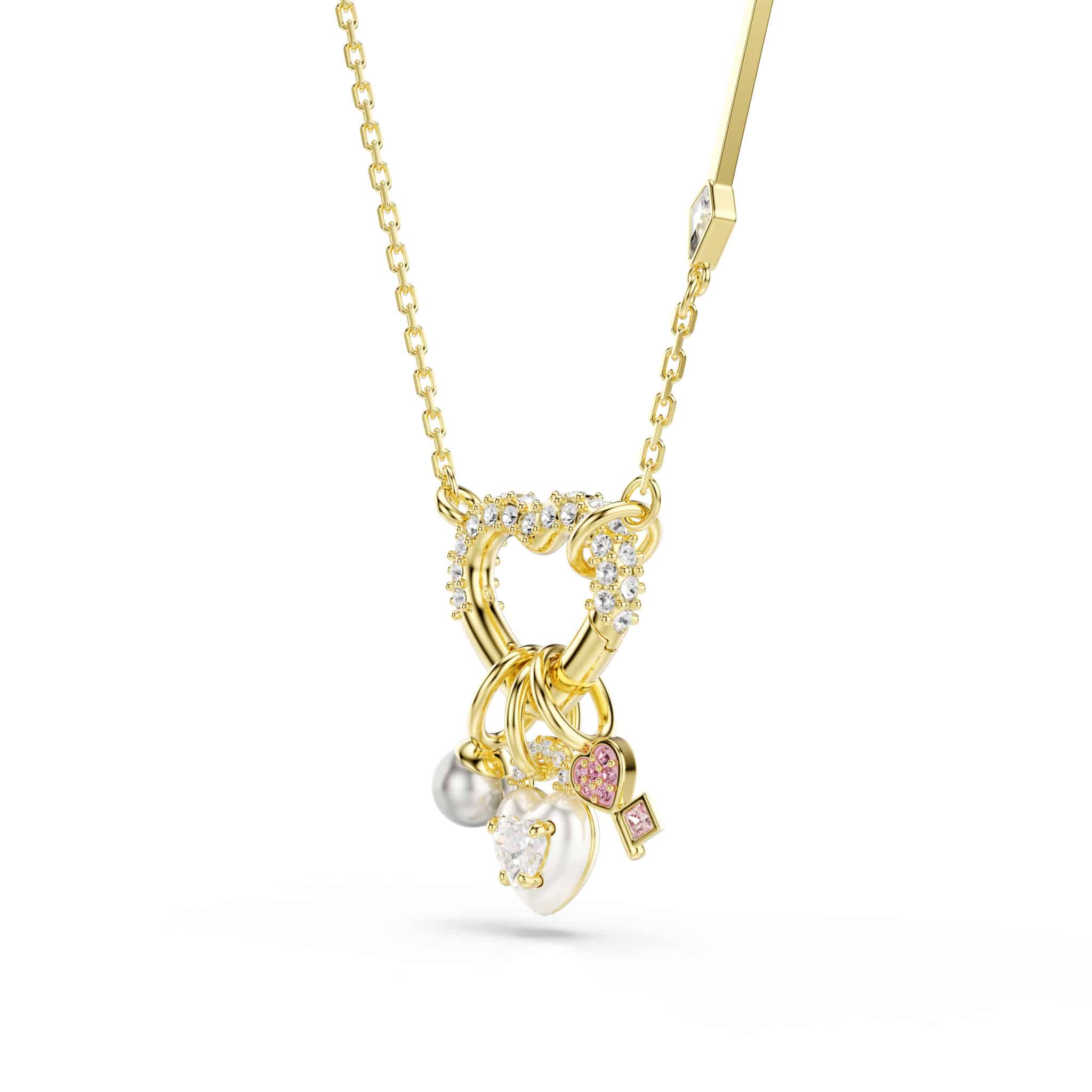 Pink Swarovski Idyllia pendant with heart and key shapes, mixed cuts, gold-tone plated jewelry accessory.
