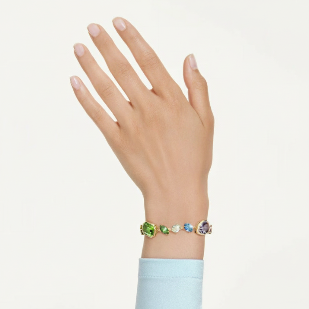 Swarovski Gema bracelet with multicolored mixed-cut crystals and gold-tone plated finish, stylish jewelry accessory.