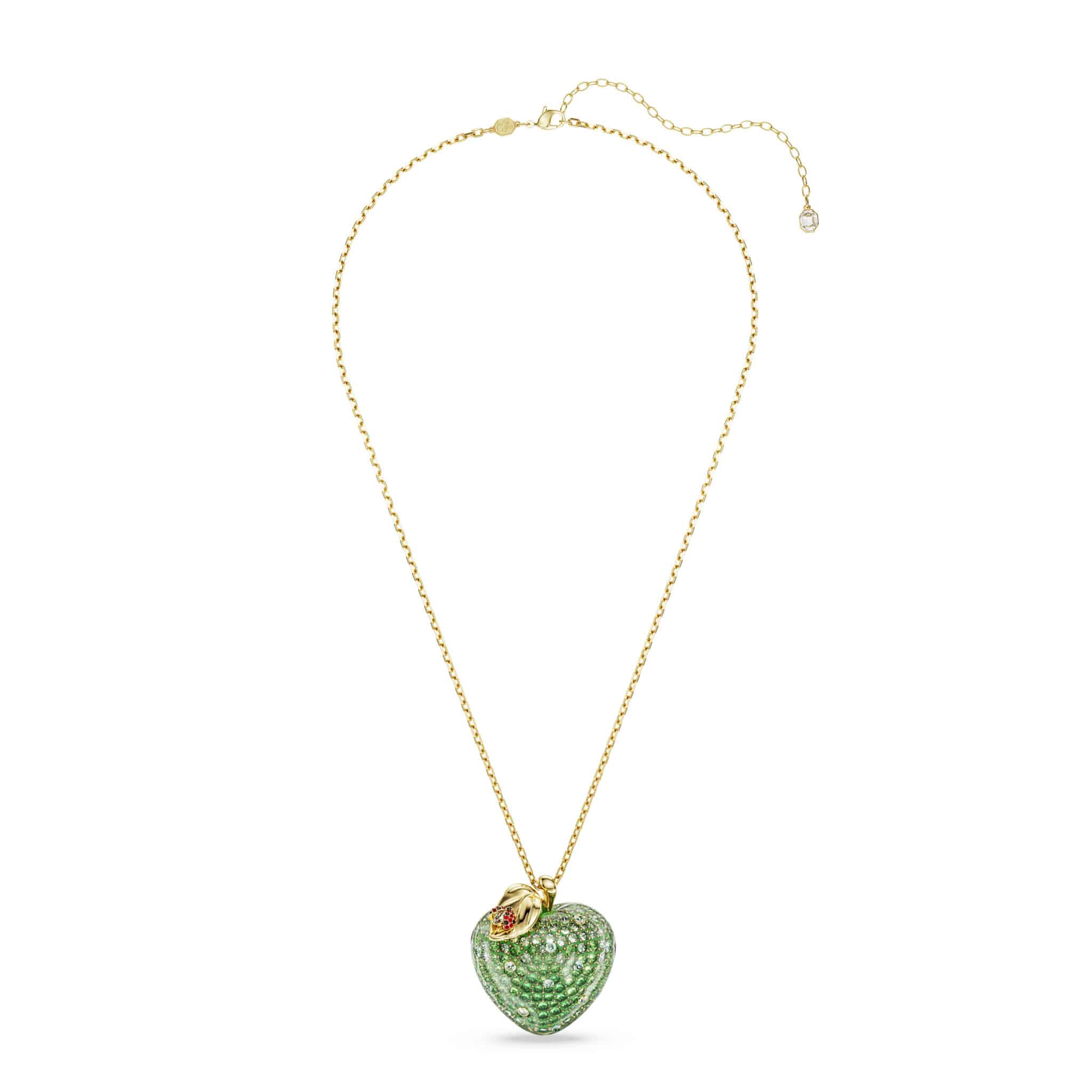 Swarovski Idyllia pendant featuring a green apple-shaped crystal with mixed cuts, gold-tone plated setting.