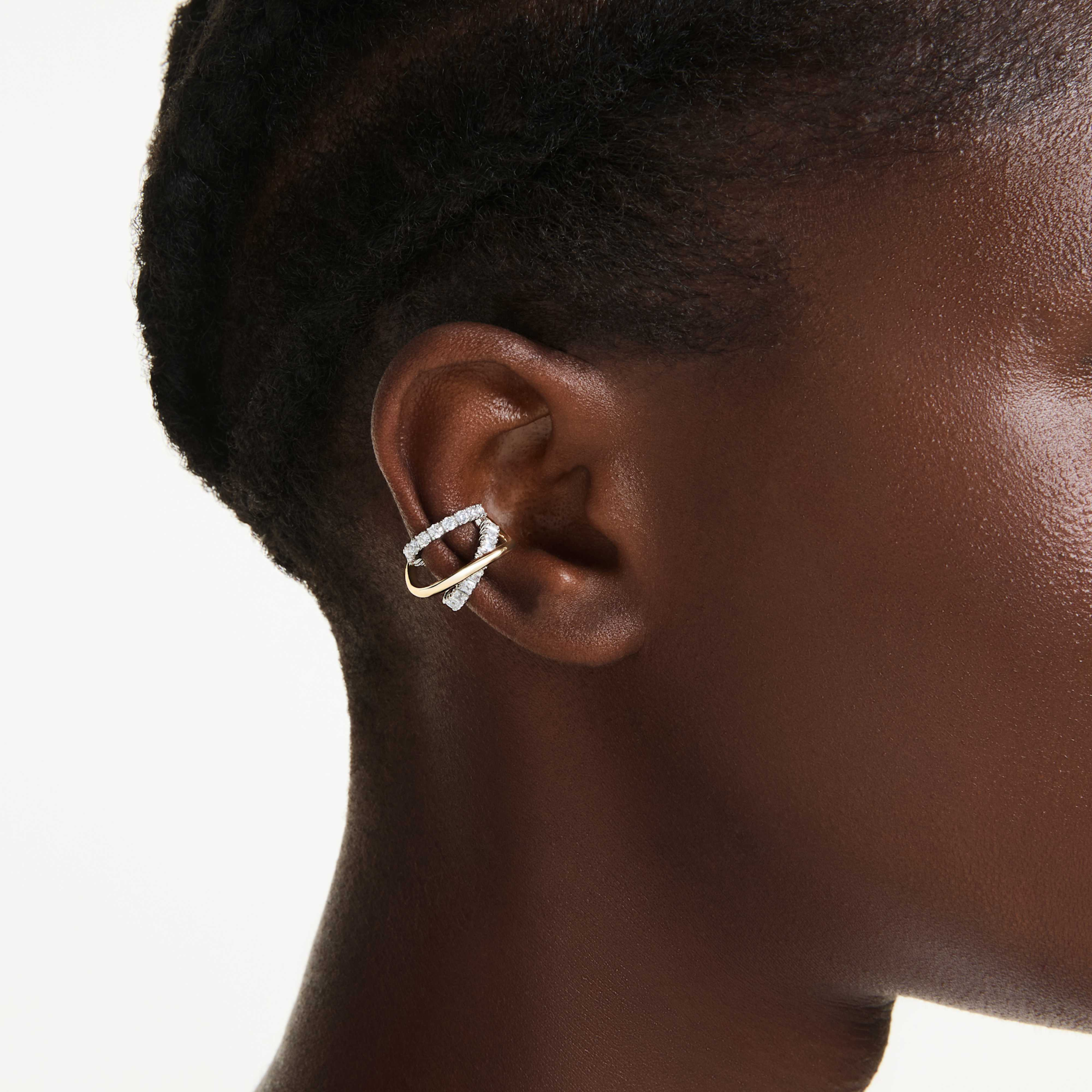 Swarovski Hyperbola ear cuffs with mixed cuts in white and mixed metal finish, stylish and modern ear jewelry.