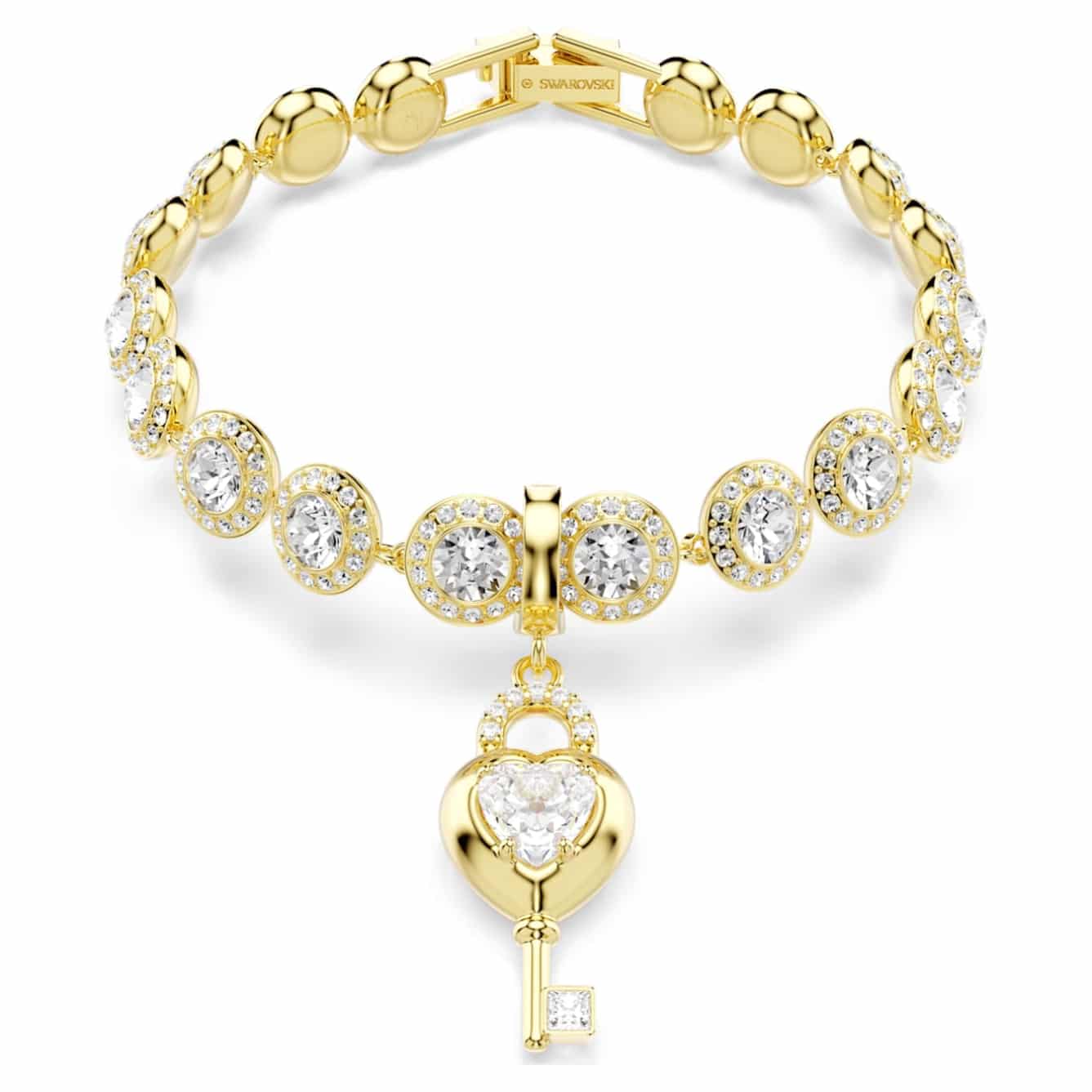 Swarovski Idyllia charm featuring a white heart with a key, mixed cuts, gold-tone plating, and sparkling crystal details.