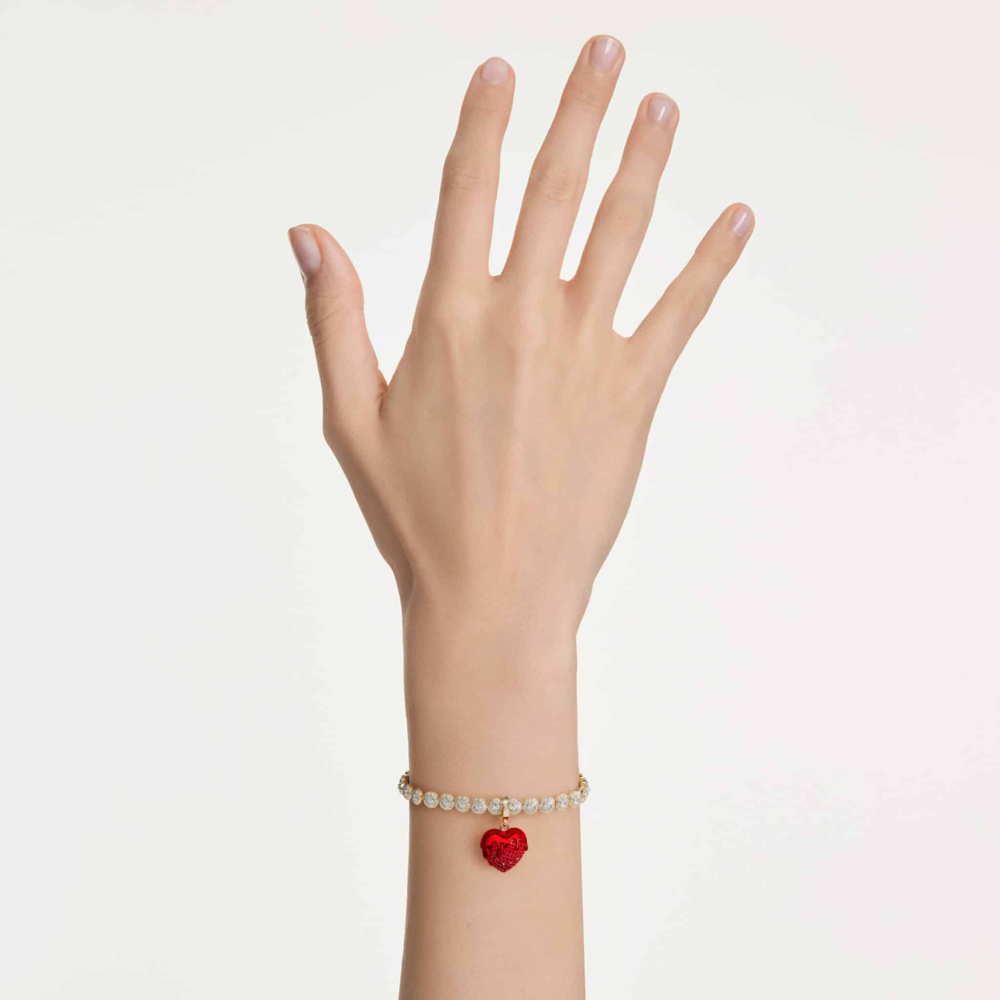 Swarovski Idyllia charm with sparkling crystals and silver-tone details, designed as a delicate jewelry accessory.
