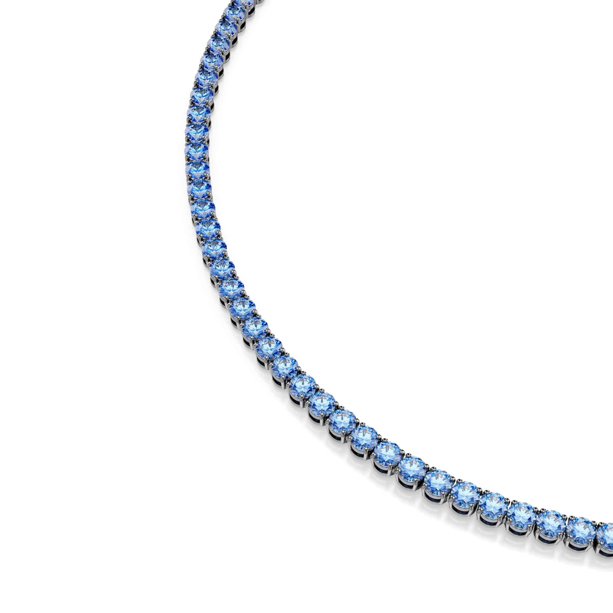 Swarovski Matrix tennis necklace with round-cut blue crystals, ruthenium plated, showcasing a elegant and sparkling jewelry piece.