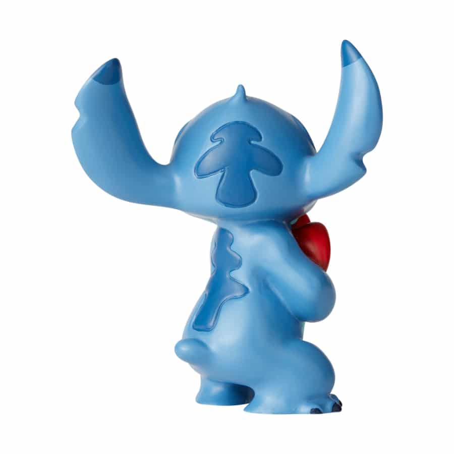 Disney Stitch plush toy holding a heart, featuring detailed Stitch character design from Disney, soft and cuddly for fans.