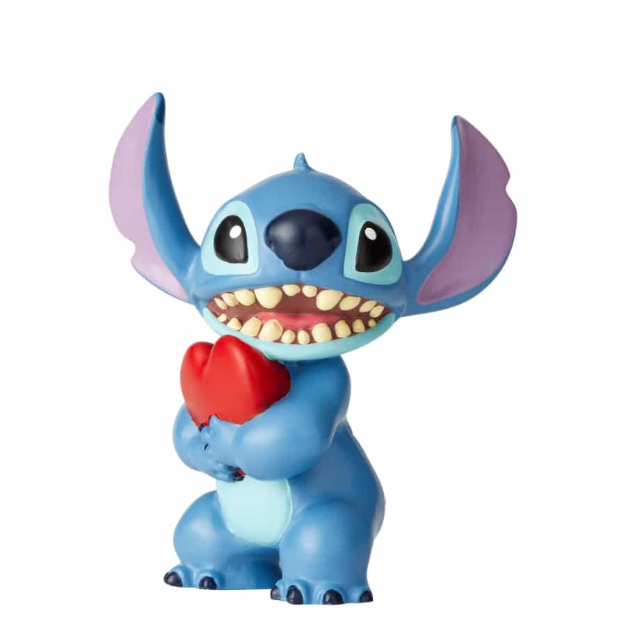 Disney Stitch plush toy holding a heart, featuring bright blue fur and embroidered facial details, perfect for Disney fans.