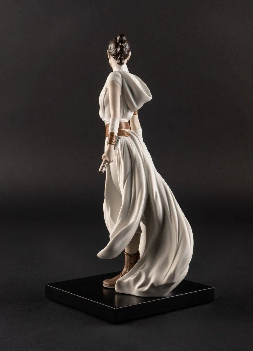 Lladro Rey™ sculpture featuring a finely crafted porcelain figure of a regal king with detailed robes and a crown.