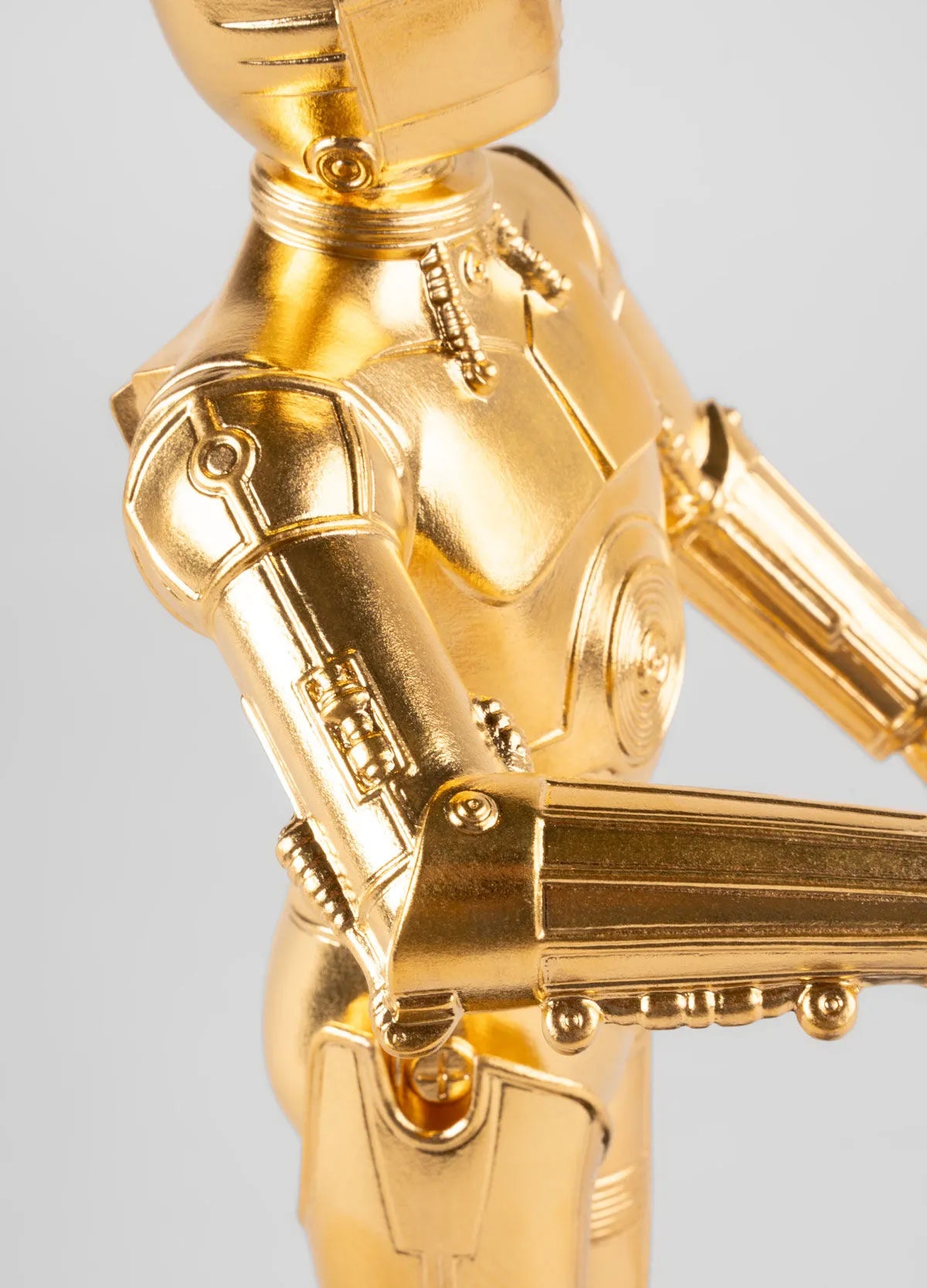 Lladro C3PO sculpture detailed porcelain figure of the Star Wars robot character on a white background
