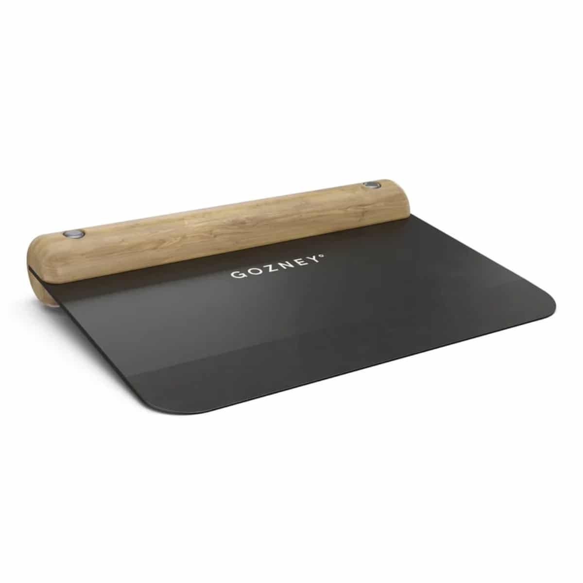 Gozney Dough Cutter with wooden handle and stainless steel blade for precise dough cutting on a baking surface.