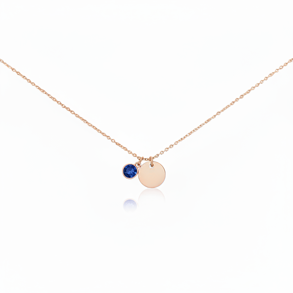 Misu rose gold necklace featuring a sapphire birthstone for September, with a delicate chain and pendant displaying the gemstone.
