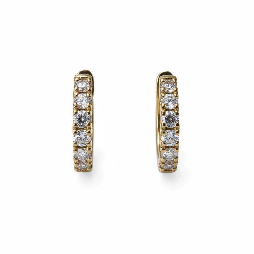 Lab grown diamond 9CT yellow gold huggie earrings with sparkling diamonds on a white background.