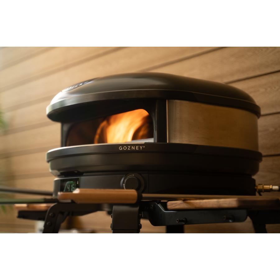Gozney Arc XL Off Black outdoor pizza oven with sleek black finish and sturdy construction for outdoor cooking.
