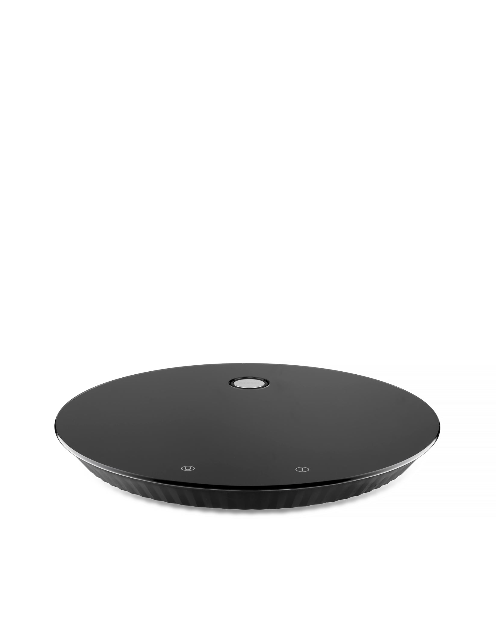 Alessi Plissé black kitchen scale with textured surface and digital display for precise food measurement.