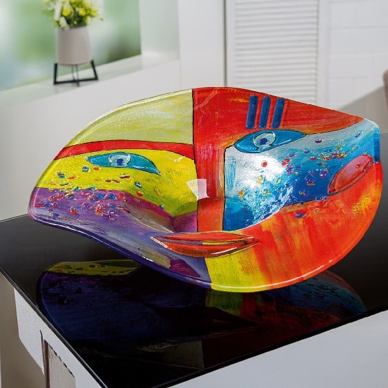 Multicolored Gilde Glassart bowl featuring a face motif, showcasing vibrant, artistic design and craftsmanship.