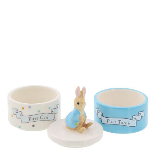 Beatrix Potter ceramic set with Peter Rabbit toothbrush holder and curl container featuring detailed illustrations.