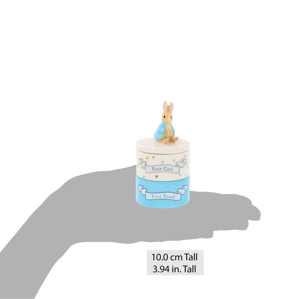 Beatrix Potter ceramic tooth and curl set featuring Peter Rabbit with detailed illustrations and pastel accents.